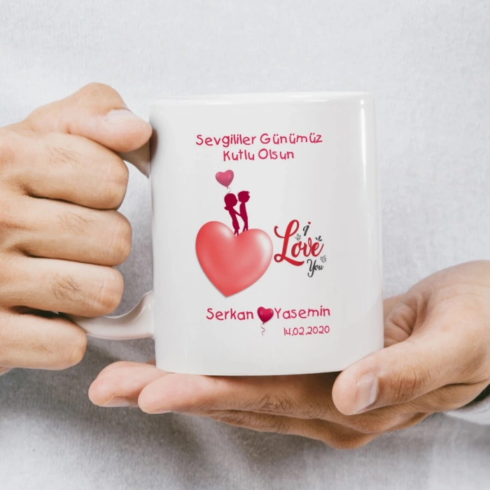 Benim meleğim... yazılı, karikatür çift ve kalplerle süslenmiş kupa baskısı.