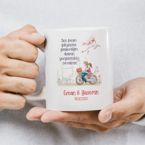 Balon ve çiçek tutan karikatür çiftin bulunduğu, Sen bile bilemezsin... yazılı kupa baskısı.