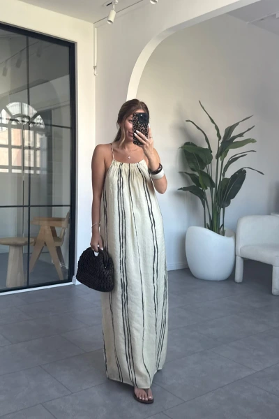 BEJ RENK MARKA MUADİLİ ASKILI MODAL ELBİSE