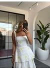 SARI ÇİÇEKLİ KAT KAT ARKASI BAĞLAMALI ELBİSE