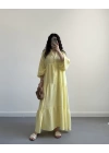 ELETA SARI MÜSLİN UZUN ELBİSE