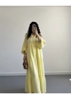 ELETA SARI MÜSLİN UZUN ELBİSE