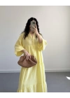 ELETA SARI MÜSLİN UZUN ELBİSE