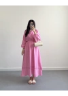 PEMBE ZIMBA DETAYLI SIRTI BAĞLAMALI MÜSLİN ELBİSE