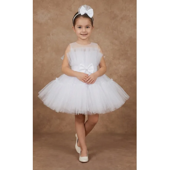 Kız Çocuk Beyaz Şeffaf Üst Ön Fiyonk Detaylı Kemerli Kabarık Elbise