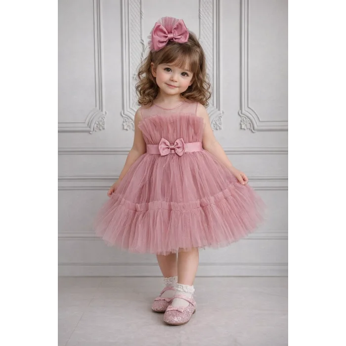 Kız Çocuk Gül Kurusu Şeffaf Üst Ön Fiyonk Detaylı Kemerli Kabarık Elbise