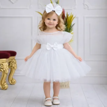 Kız Çocuk Beyaz Şeffaf Üst Ön Fiyonk Detaylı Kemerli Kabarık Elbise