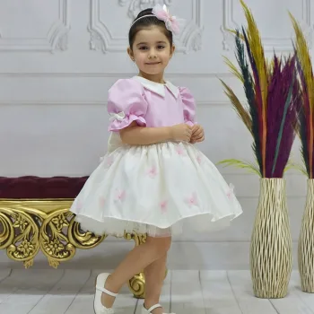 Kız Çocuk Şeker Pembesi Krem Bebe Yakalı Etekli Kelebek İşlemli Kabarık Elbise