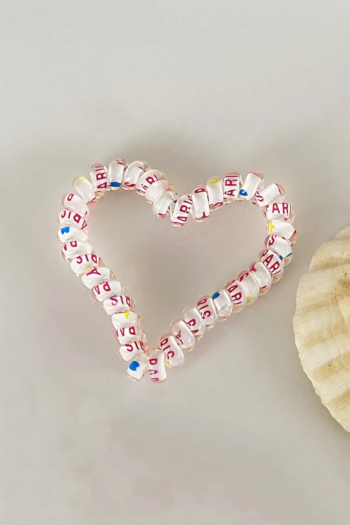 Beyaz Renk Kalpli Helezon Lastik Toka