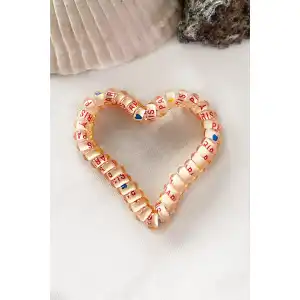 Açık Turuncu Renk Kalpli Helezon Lastik Toka