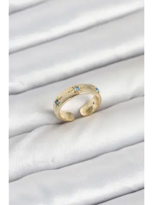 Pirinç Gold Renk Mavi Zirkon Taşlı Kutup Yıldızı Model Kadın Yüzük