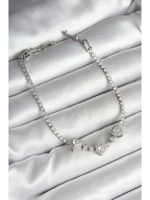 Pirinç Sıralı Kalp Figürlü Zirkon Taşlı Gümüş Renk Kadın Bileklik