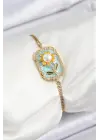 316L Çelik Zincir Turkuaz Mineli Sanatsal Portre İnci Detaylı Papatya Model Gold Renk Kadın Bileklik