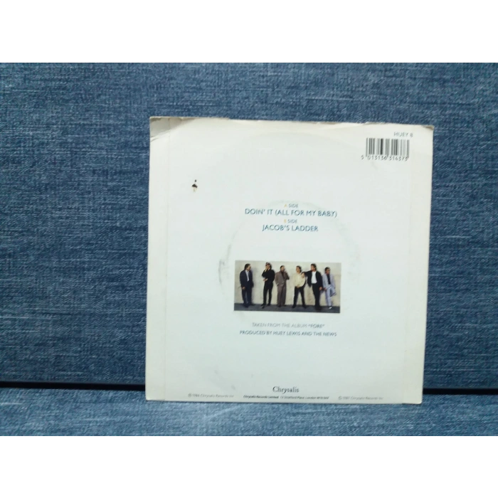 HUEY LEWIS DOING IT ALL FOR