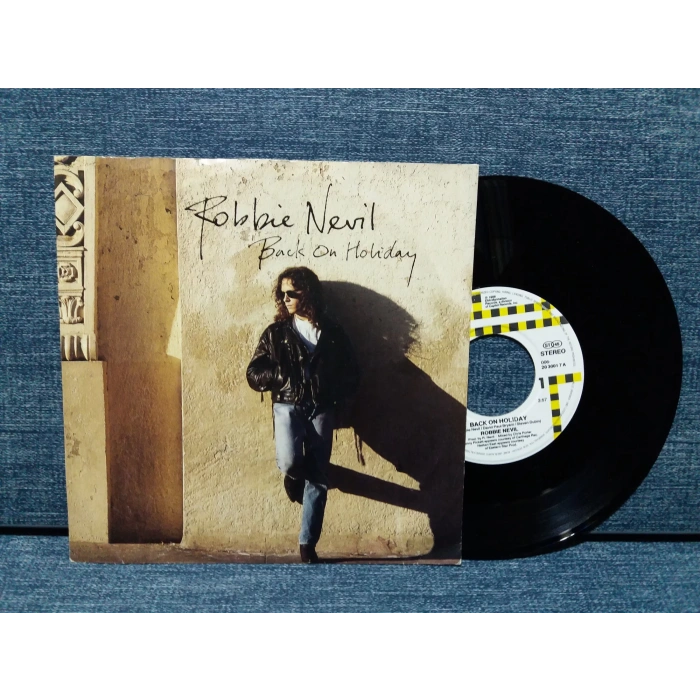 ROBBIE NEVIL BACK ON HOLIDAY