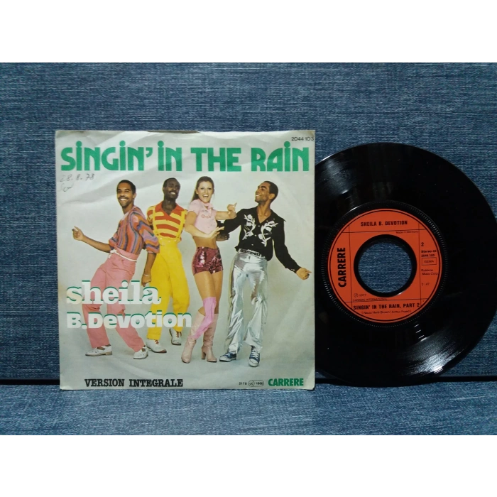 SHEILA B.DEVOTION SINGININ THE RAIN