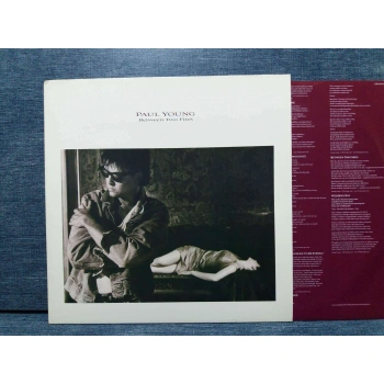 PAUL YOUNG BETWEEN TWO FIRES