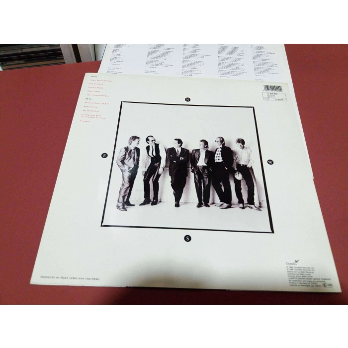 HUEY LEWIS SMALL WORLD