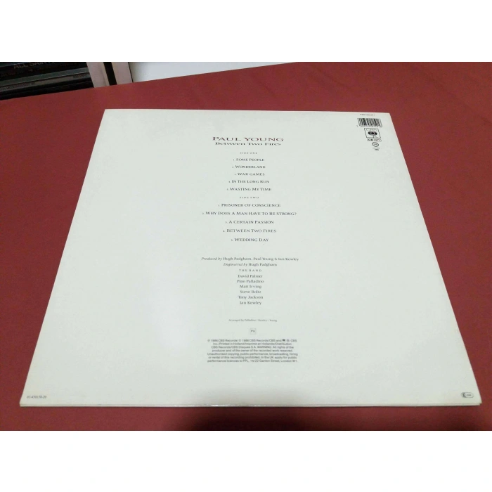 PAUL YOUNG BETWEEN TWO FIRES