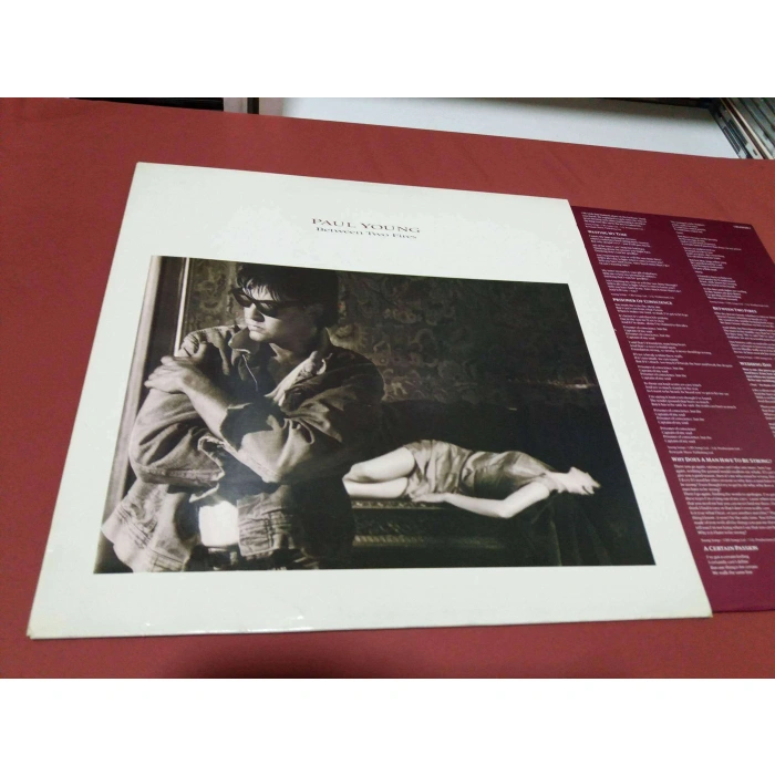 PAUL YOUNG BETWEEN TWO FIRES