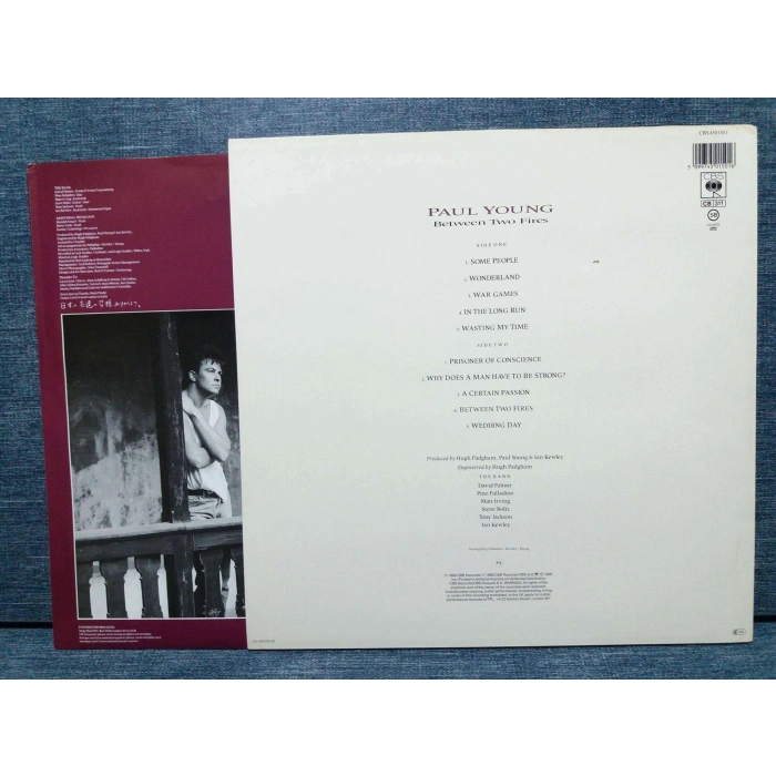 PAUL YOUNG BETWEEN TWO FIRES