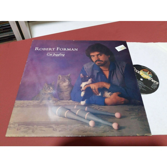 ROBERT FORMAN CAT JUGGLING