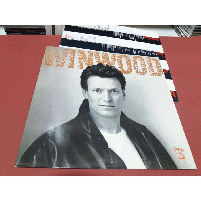 STEVE WINWOOD ROLL WITH IT