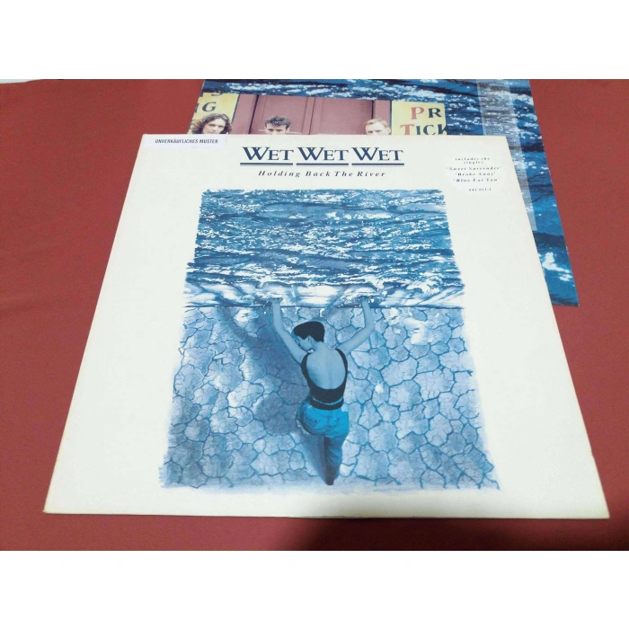 WET WET WET HOLDING BACK