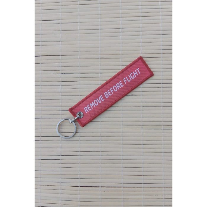 aksungur remove before flight yazili kirmizi beyaz nakis islemeli bez anahtarlik