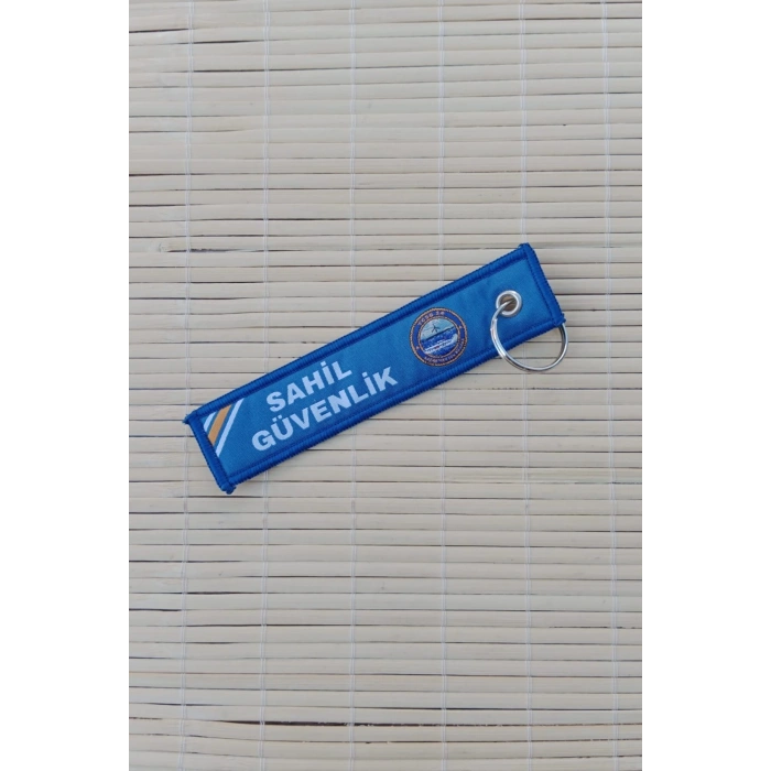 Sahil guvenlik tcsg 24 yazili mavi beyaz nakis islemeli bez anahtarlik