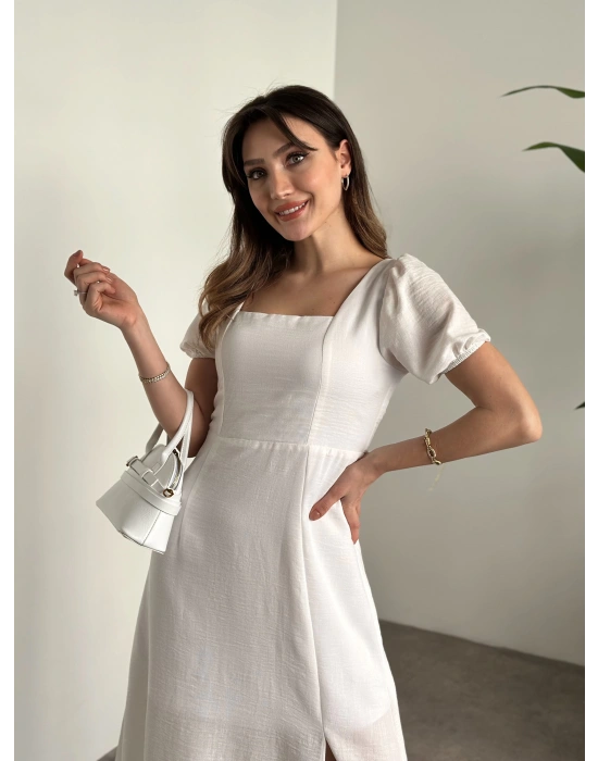 Sırt dekolteli ve yırtmaçlı keten elbise beyaz