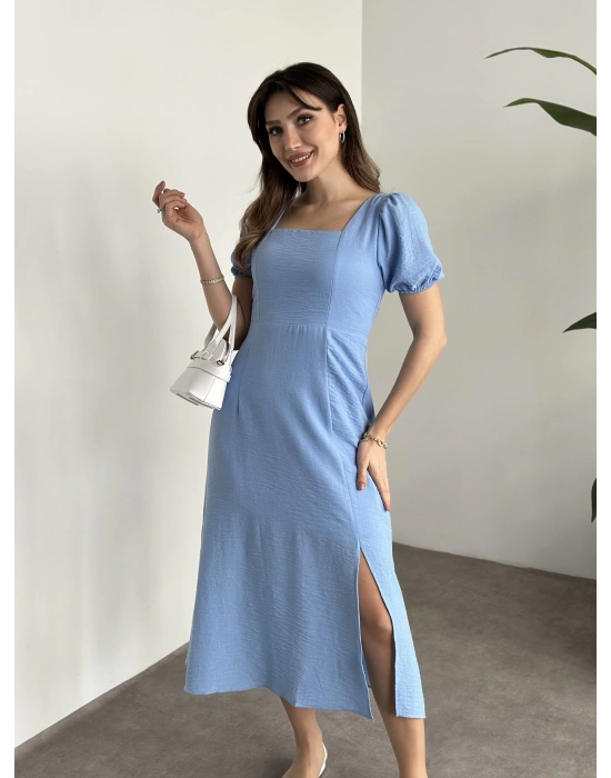 Sırt dekolteli ve yırtmaçlı keten elbise mavi