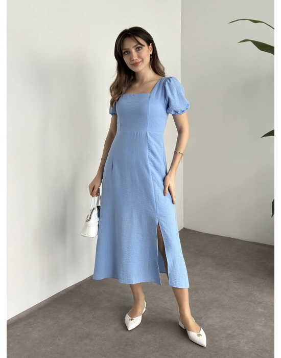 Sırt dekolteli ve yırtmaçlı keten elbise mavi