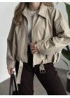 Marka model oversize kesim kemerli deri mont krem