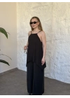 Marka model Halter yaka asimetrik kesim tulum siyah