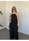 Marka model Halter yaka asimetrik kesim tulum siyah