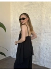 Marka model Halter yaka asimetrik kesim tulum siyah
