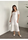 Sırt dekolteli ve yırtmaçlı keten elbise beyaz