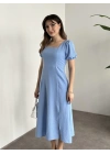 Sırt dekolteli ve yırtmaçlı keten elbise mavi