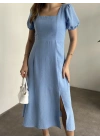 Sırt dekolteli ve yırtmaçlı keten elbise mavi