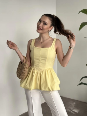 Belden oturtmalı balon etekli tasarim bluz sarı