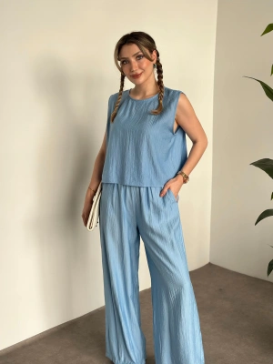 Sırtı bağlama dekolte detaylı tensel kumaş takım bebek mavisi