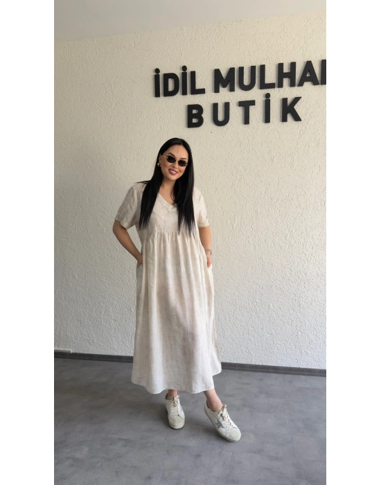 Bej Batik Desenli Dökümlü Elbise
