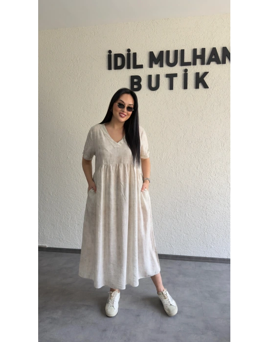 Bej Batik Desenli Dökümlü Elbise