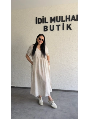 Bej Batik Desenli Dökümlü Elbise