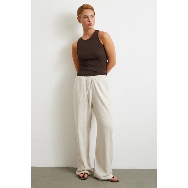 Beli Lastikli Boru Paça Pantolon Bej