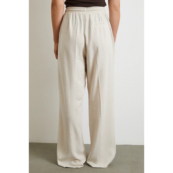 Beli Lastikli Boru Paça Pantolon Bej