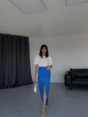 GABARDİN UZUN ÖNDEN YIRTAÇI ETEK  aks