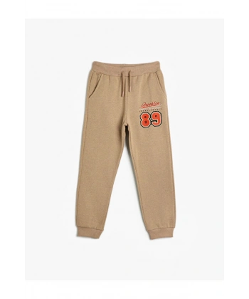 Koton Basic Jogger Eşofman Altı Spor Temalı Baskı Detaylı Beli Bağlamalı Şardonlu