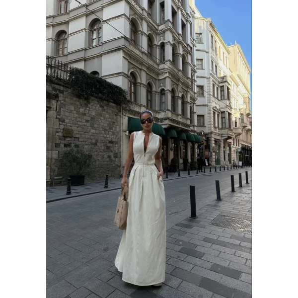 Dik Yuvarlak Yaka Önden Fermuarlı Sifir Kol Beli Oturtmalı Kolsuz Cepli Çan Etekli Uzun Elbise - Beyaz